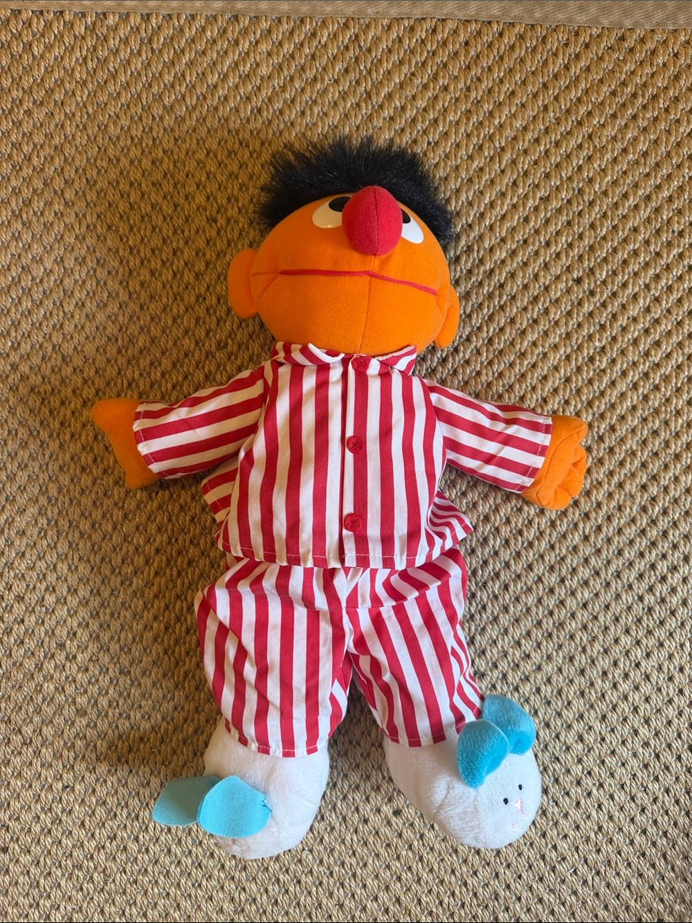 Plush Orange Character Doll in Red & White Striped Pajamas